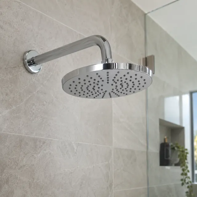 Chrome water-saving showerhead in a bathroom