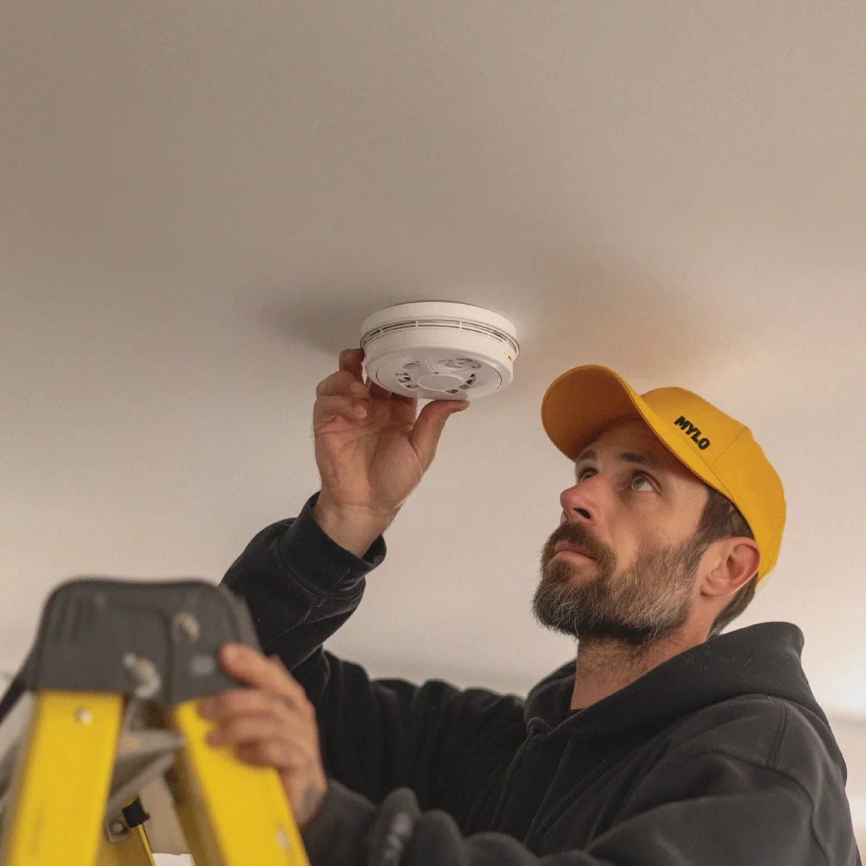 MYLO technician checking a smoke alarm in a Victorian property