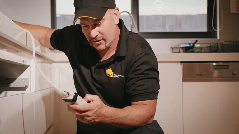 MYLO technician carrying out a safety check in a home